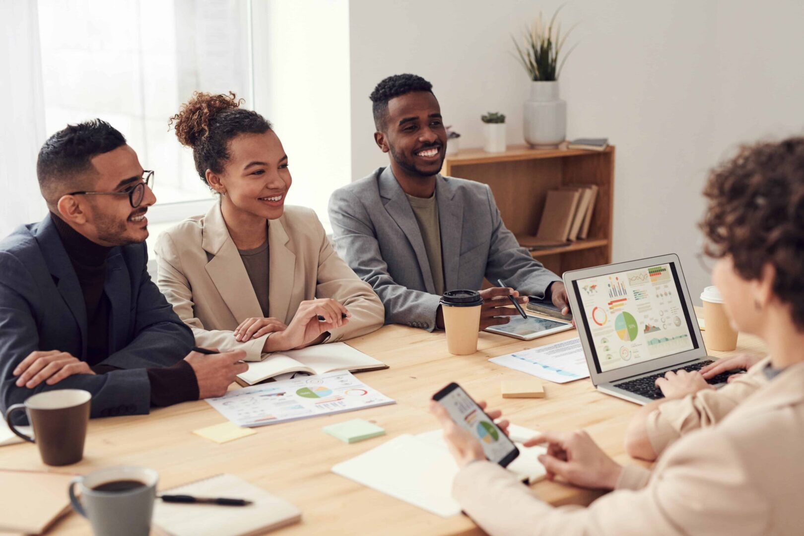 A group of people sitting around a table.